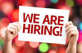 we are hiring sign being held up by hands